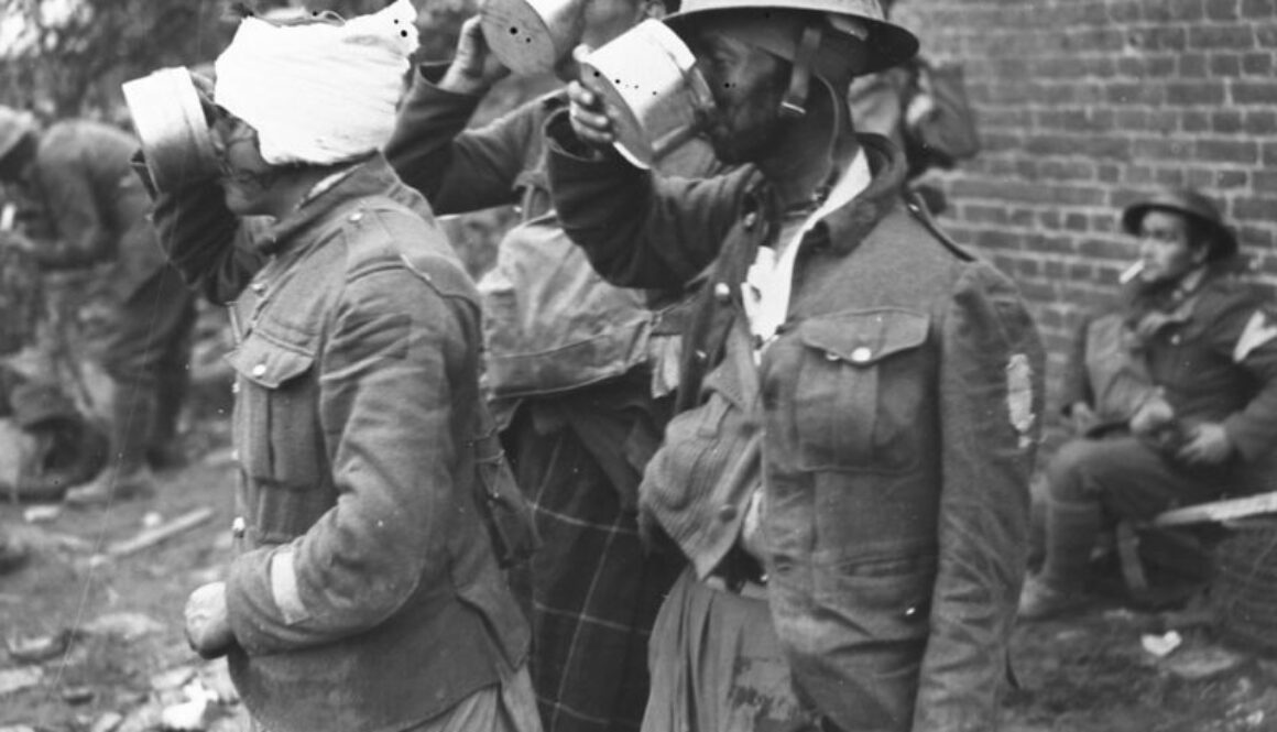 230_Canadian wounded enjoying a cup of tea at Advanced Dressing Station. Advance East of Arras. October, 1918.